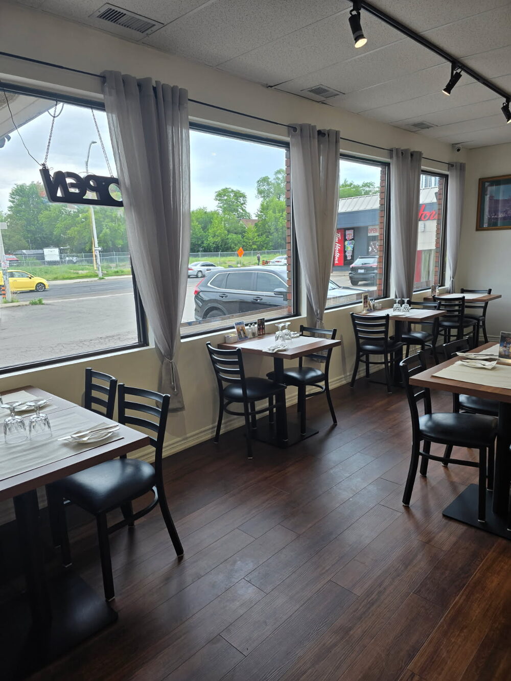 A view across the renovated dining room toward the bar at Shehnai Restaurant